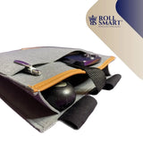Graue filz smart tasche mit orangefarbenem lederbesatz und schwarzen elastikbändern von roll smart für armlehnen
